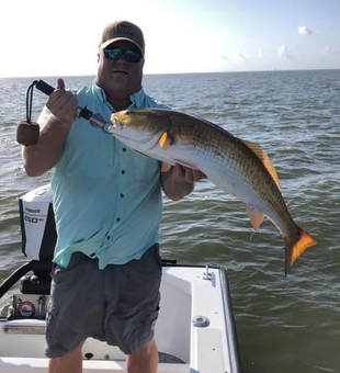 Reel in Redfish memories on Galveston's shores.